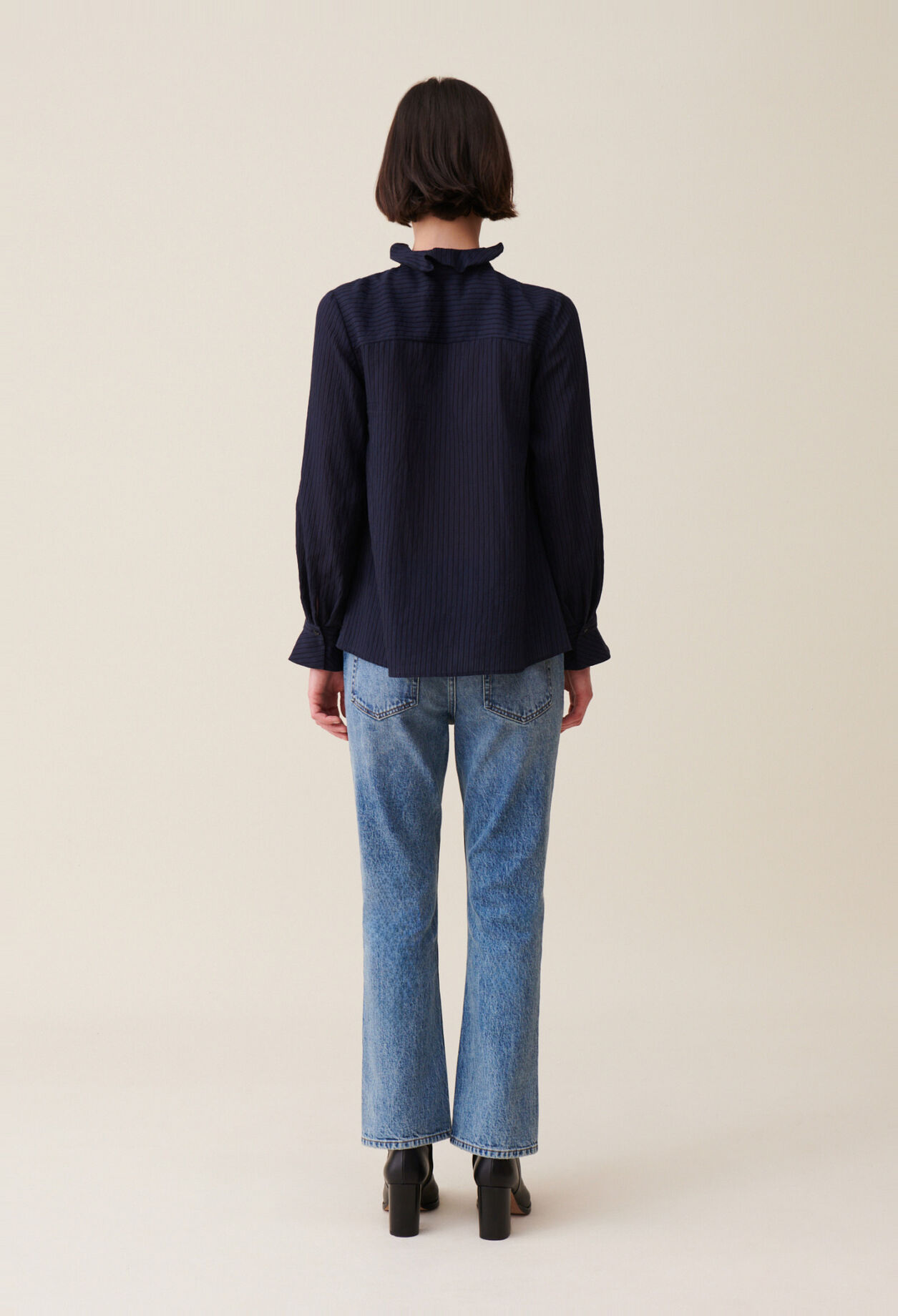 Dark blue striped ruffled blouse
