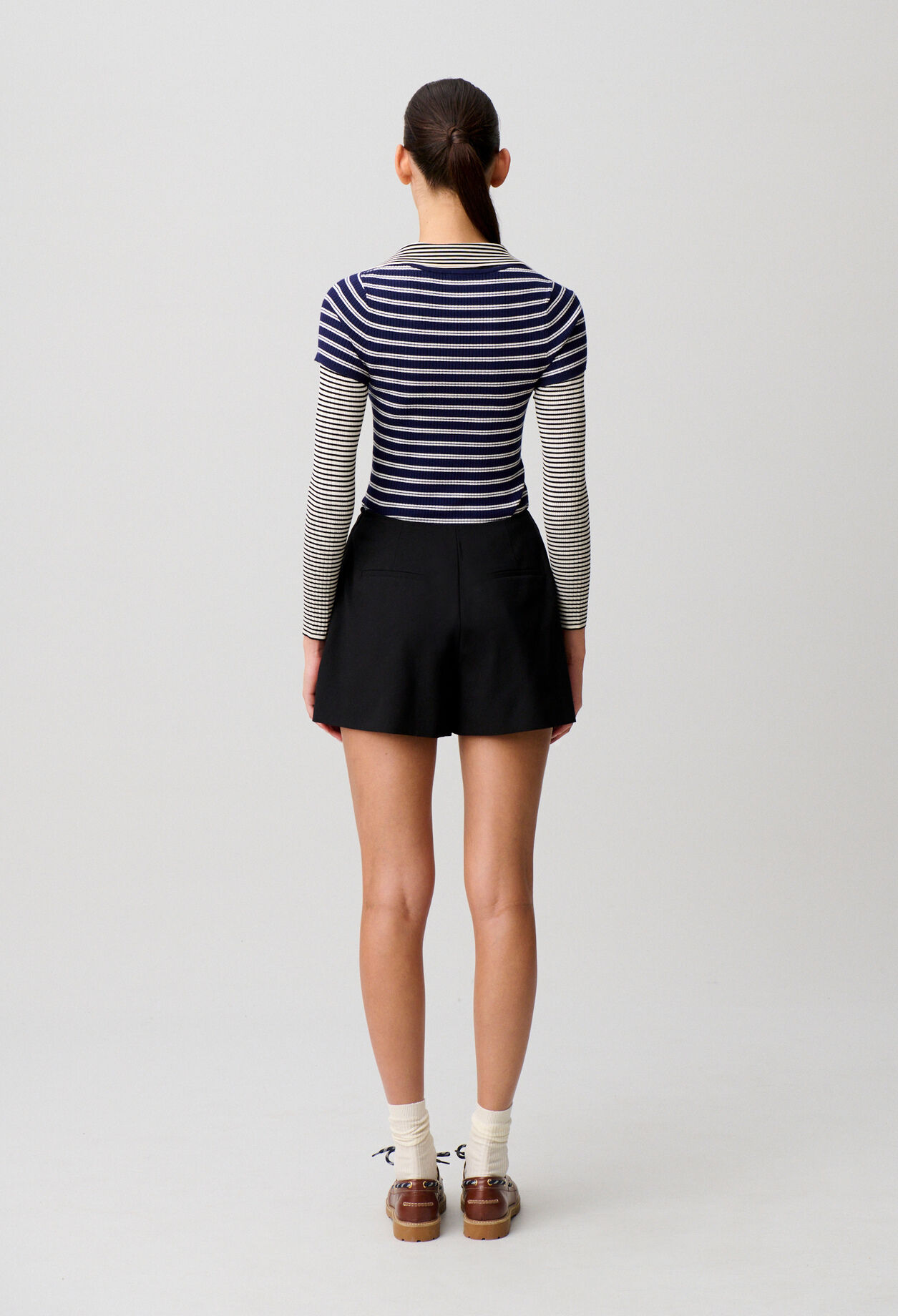 Black flared pleated shorts