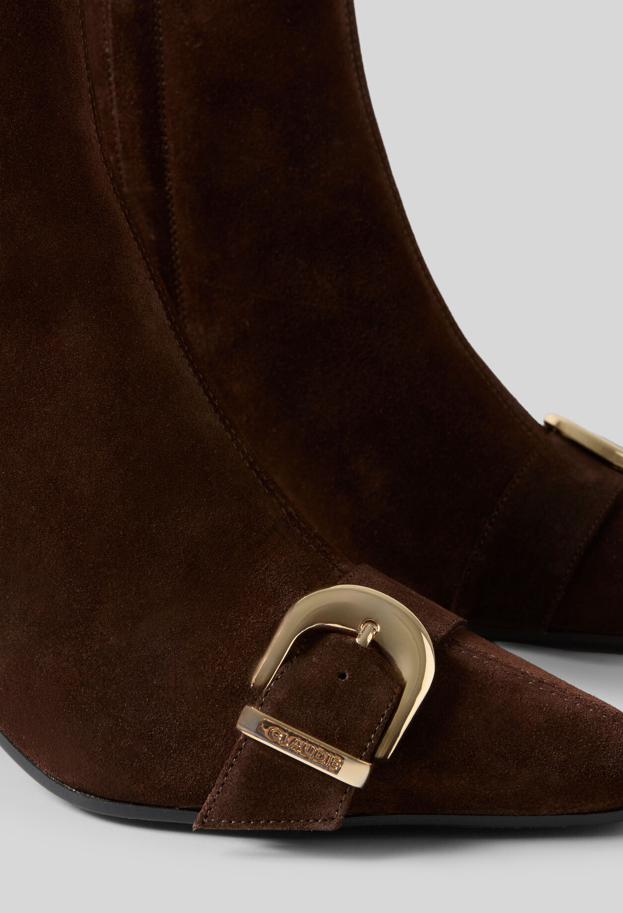 Suede ankle boots with gold buckle