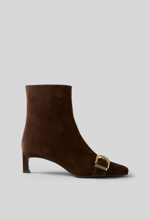 Suede ankle boots with gold buckle