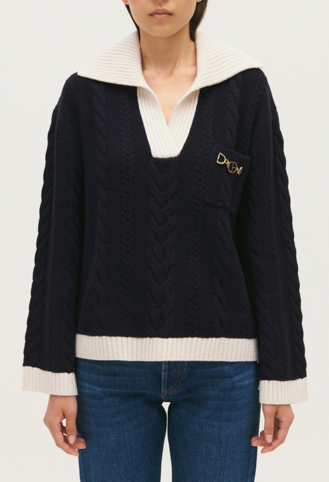 Navy blue cable-knit jumper