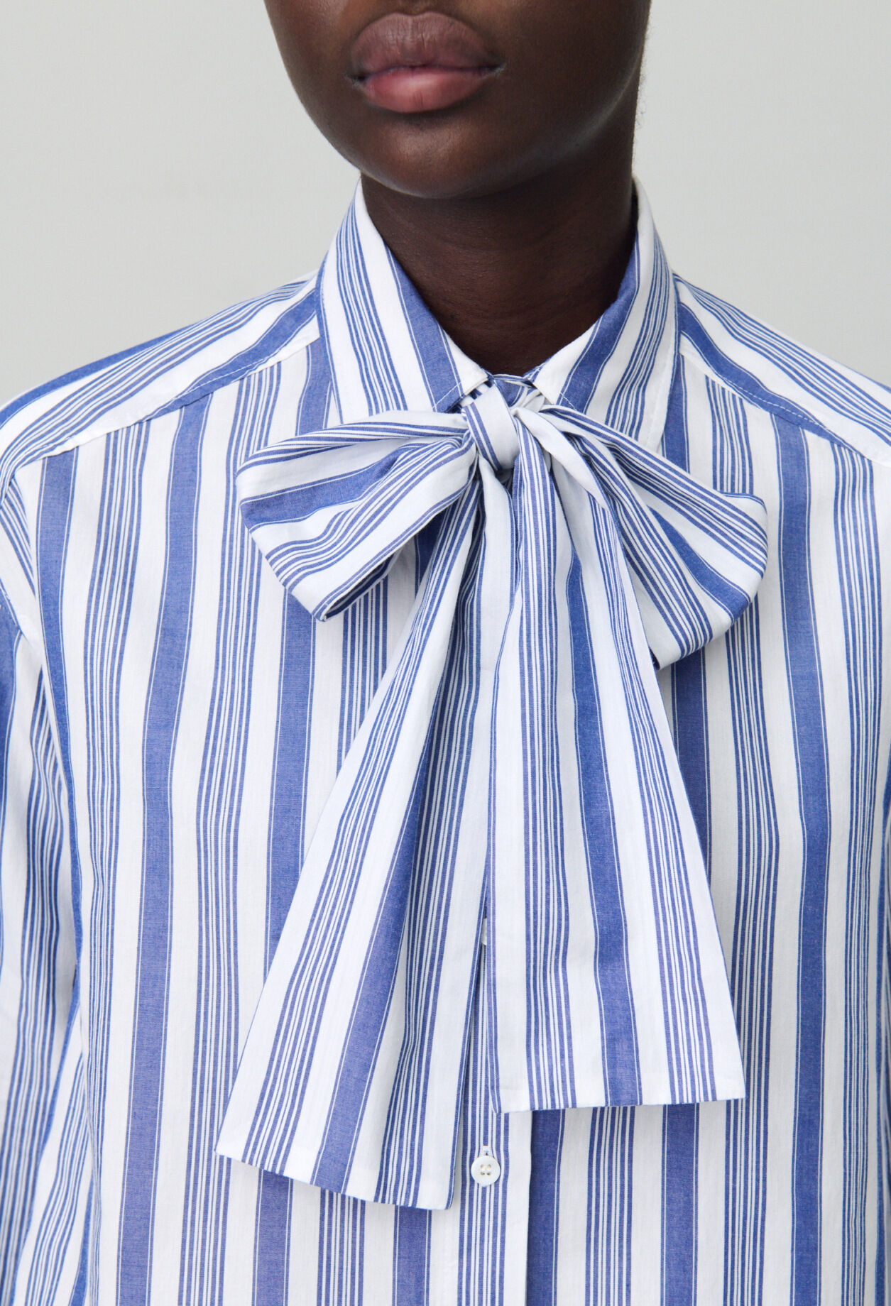 Striped shirt with bow collar