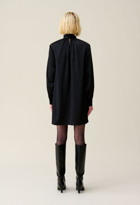 Flowing dress with black bow collar