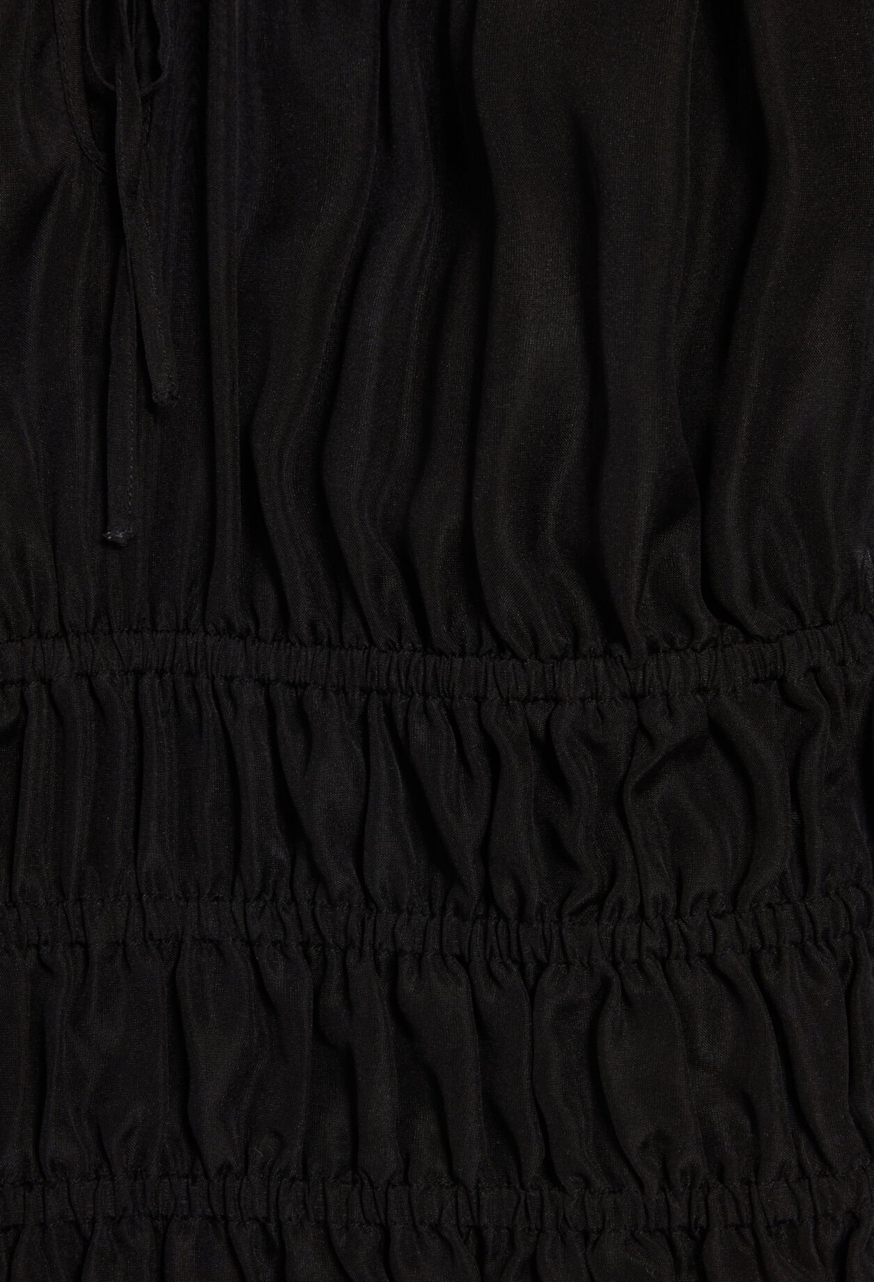Short black ruffled blouse