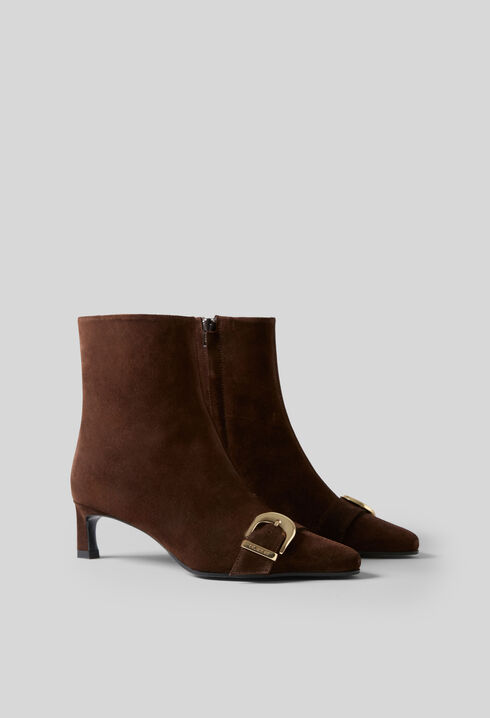 Suede ankle boots with gold buckle