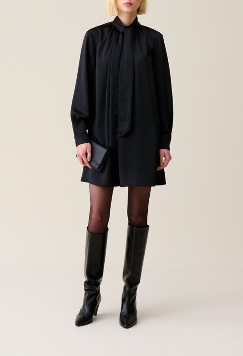 Flowing dress with black bow collar