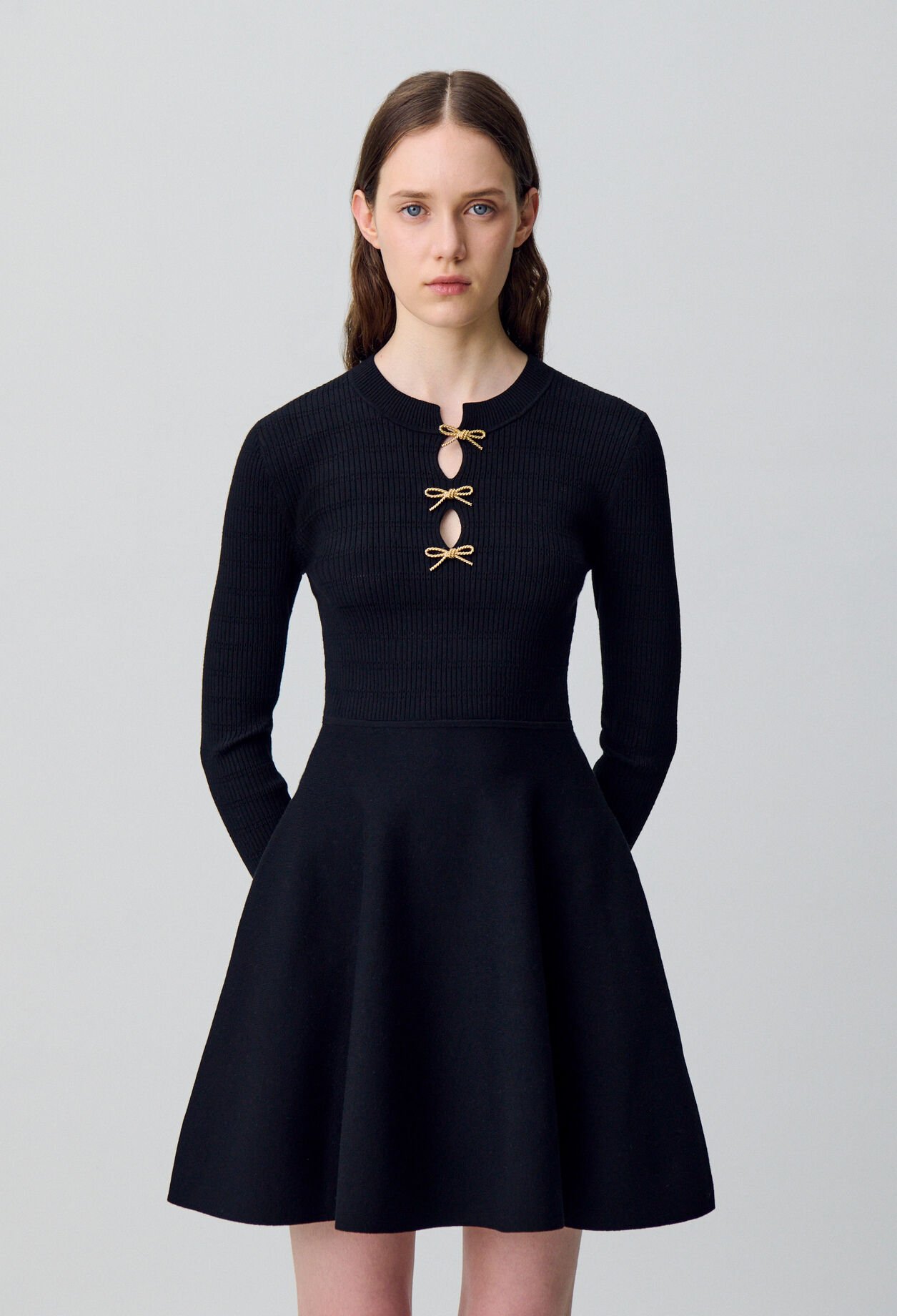 Short knitted dress with knots