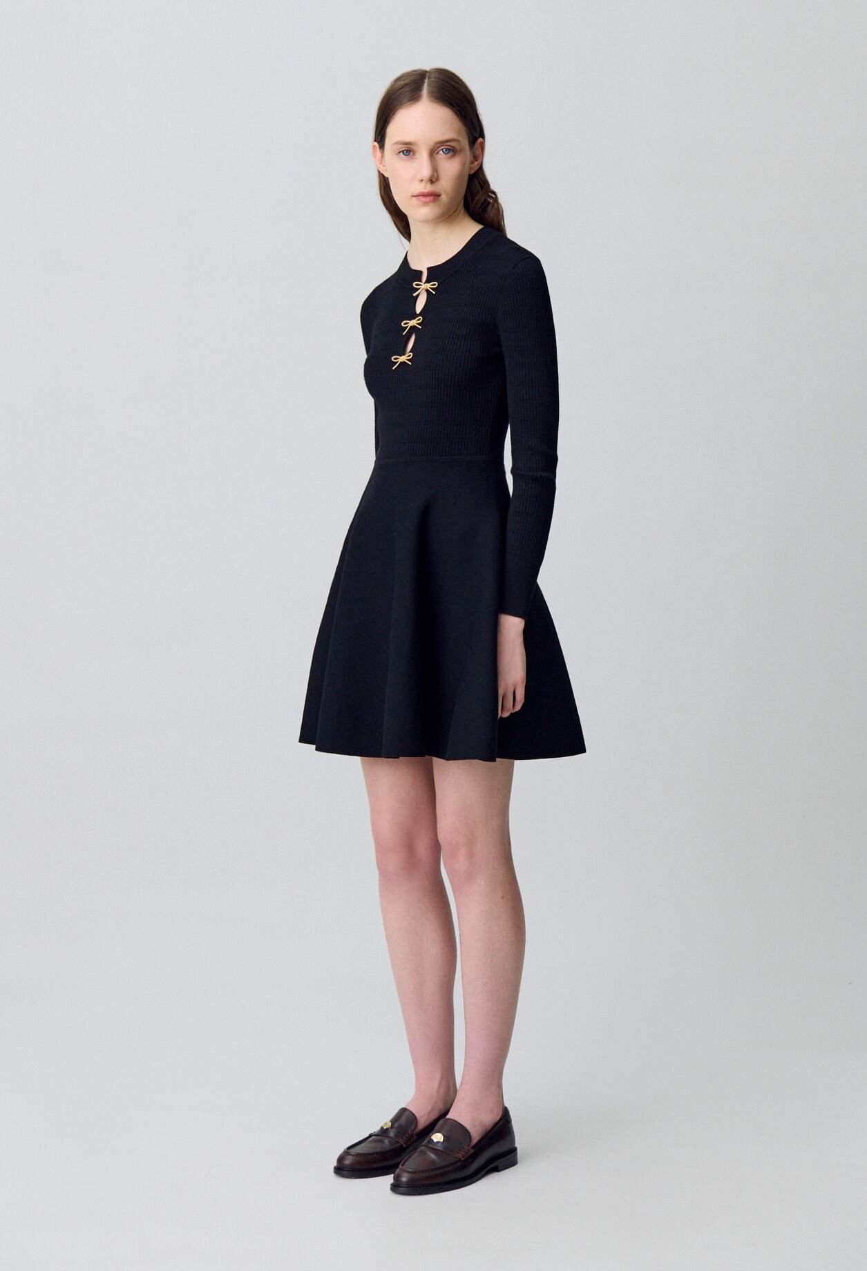 Short knitted dress with knots