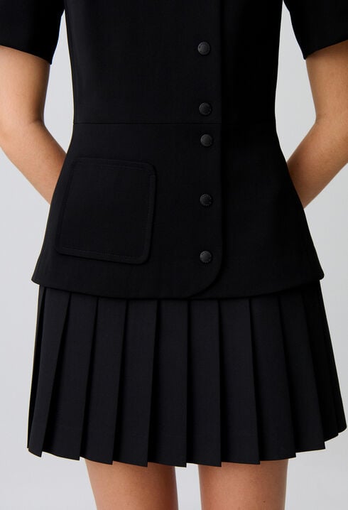 Short pleated peplum dress