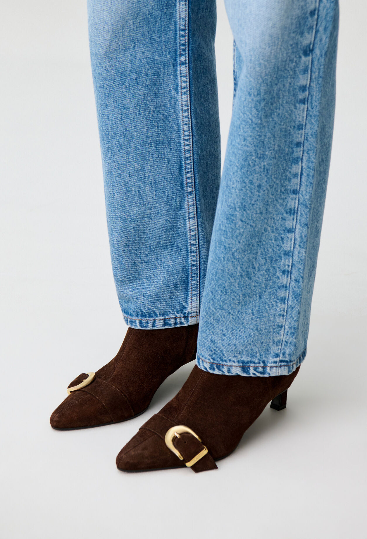 Suede ankle boots with gold buckle