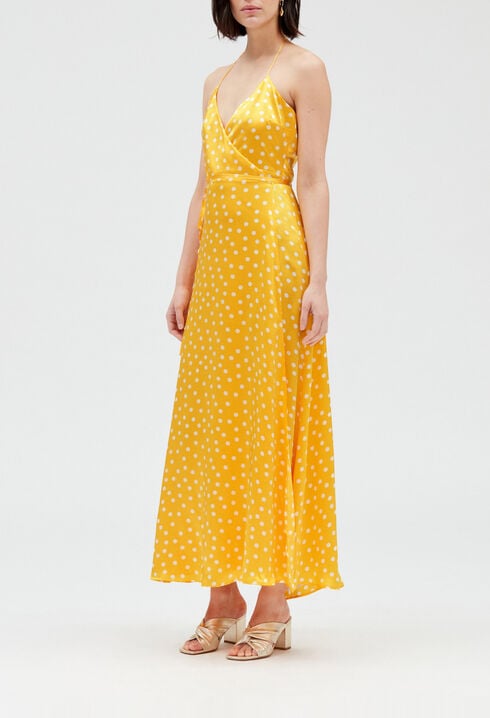 Long yellow silk wraparound dress.