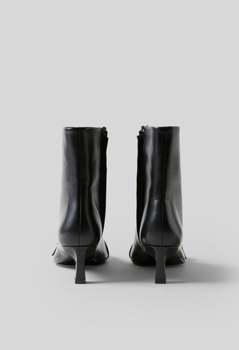Gold buckle leather ankle boots