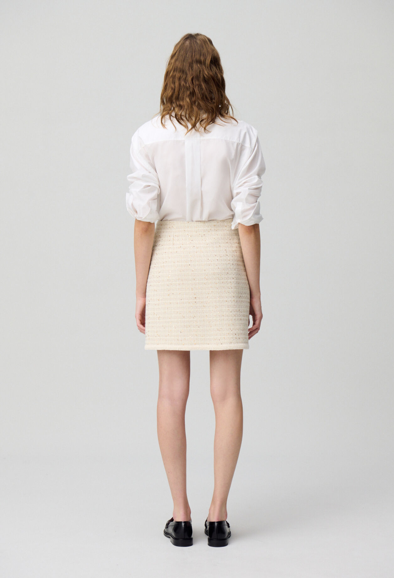 Buttoned tweed mini skirt