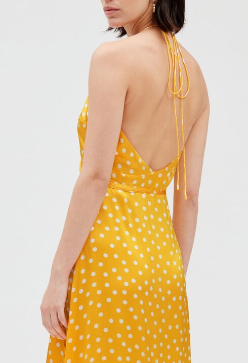 Long yellow silk wraparound dress.