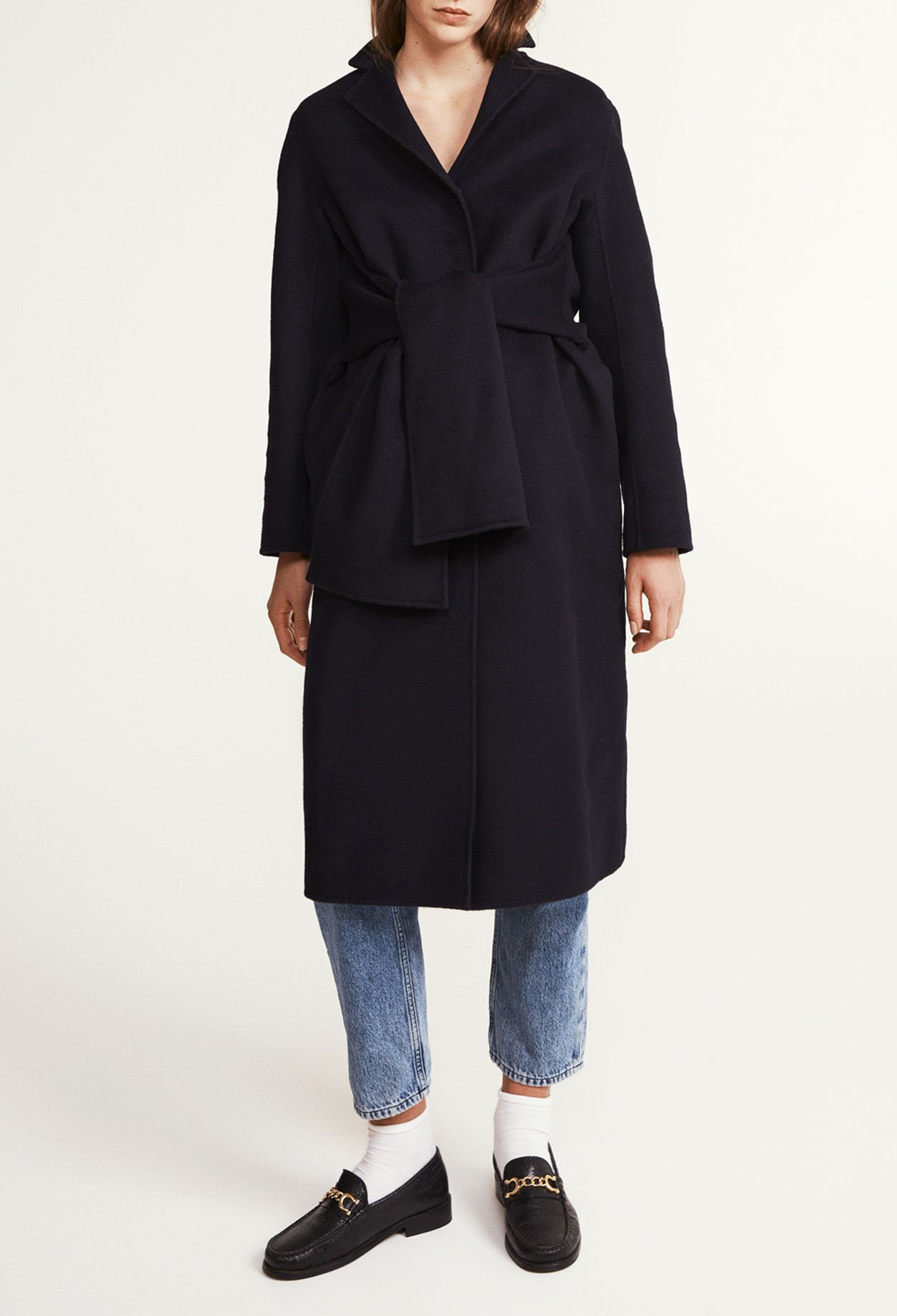 Coat with tie belt clearance