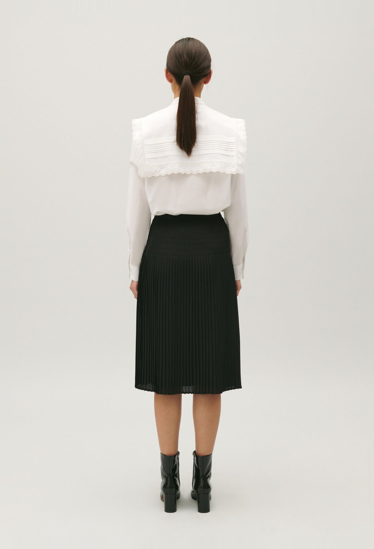 Black pleated mid-length skirt