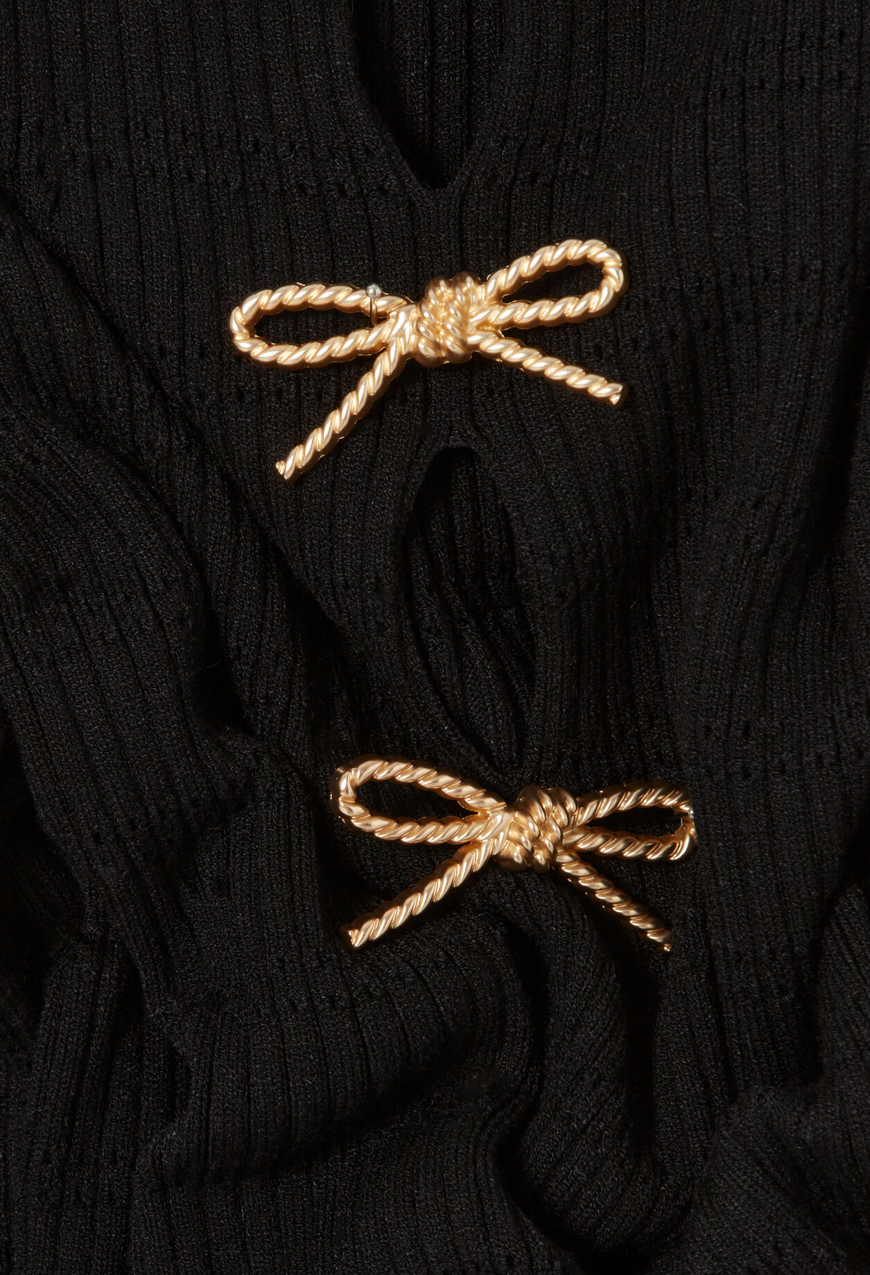 Short knitted dress with knots